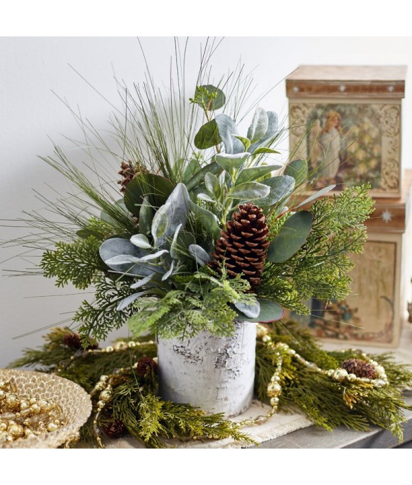 Mixed flower arrangement of greenery and pine cones